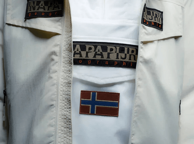 Napapijri logo patch detail on light-coloured jacket fabric close-up
